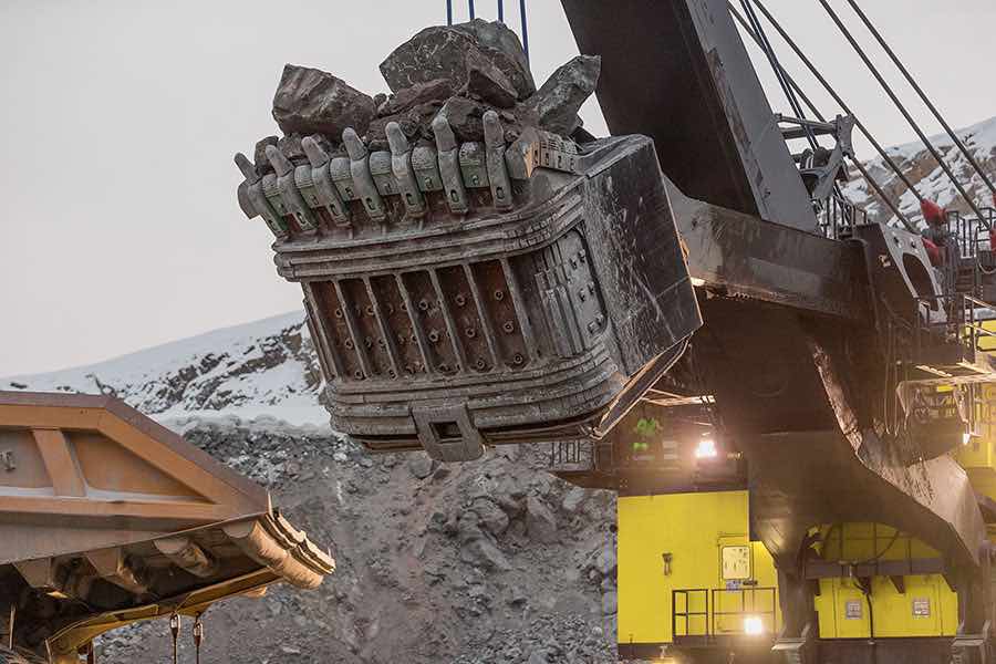 Image: mining shovel loads haul truck. Mines often experience hang time during this procedure; eliminate hang time to move millions more tons of material per truck, per year.